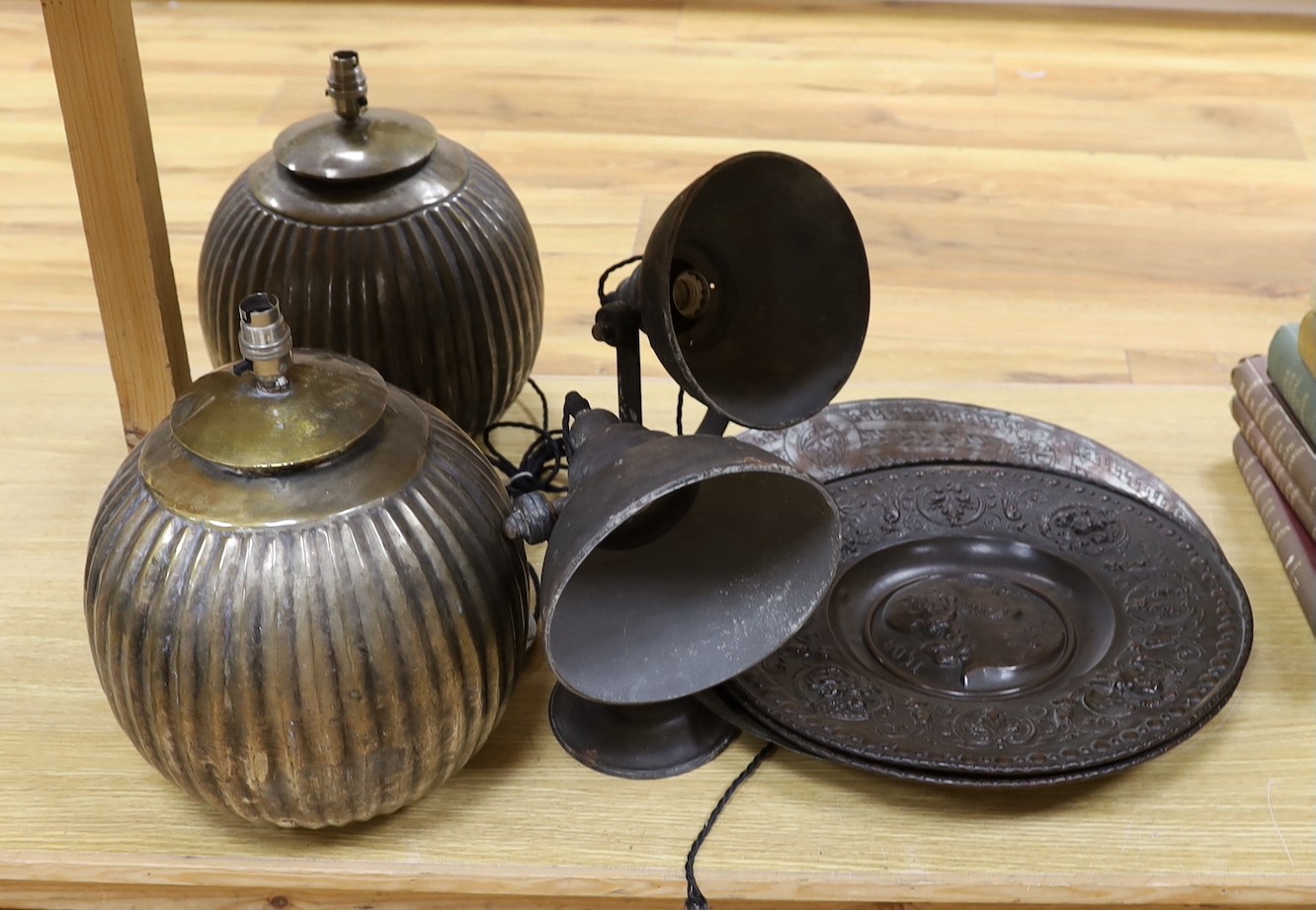 Two pairs of lamps and three metalwork chargers, largest charger 46 cms diameter